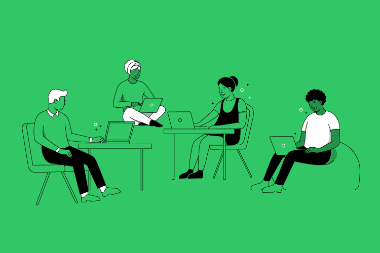 Four people sitting, working on laptops